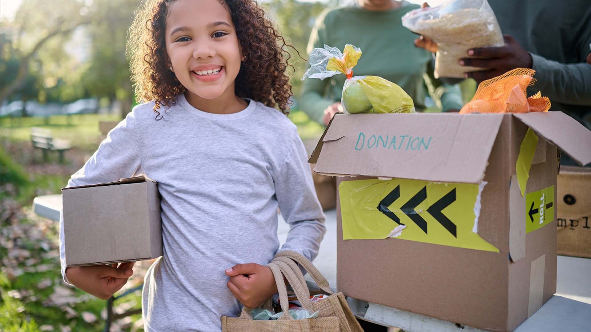 Young girl with box of food