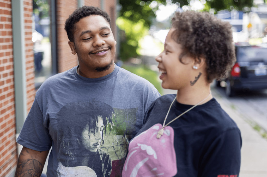 Young couple smiling at each other
